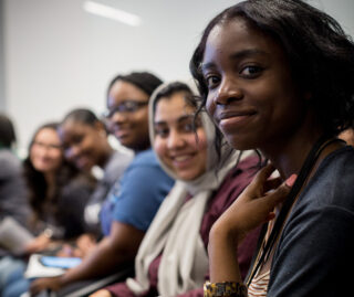 Students in audience smiling